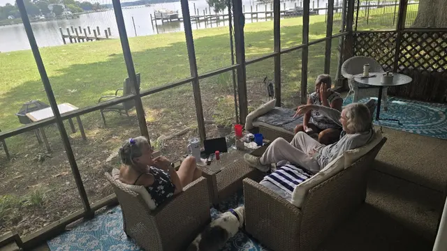 Porch sitting with friends and the Basset and Pug
