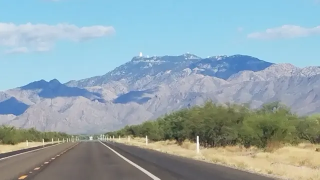 Distant mountain peaks over the desert highway