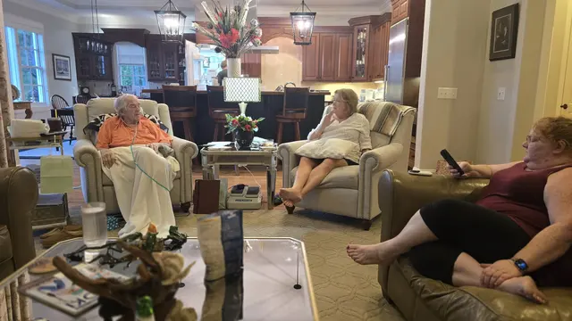 Everyone gathered together in the living room.