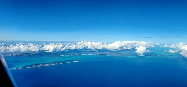 Touching down in Cancun — turquoise coastline from the air as the trip begins.