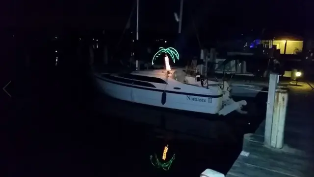 sailboat docked at night with lights