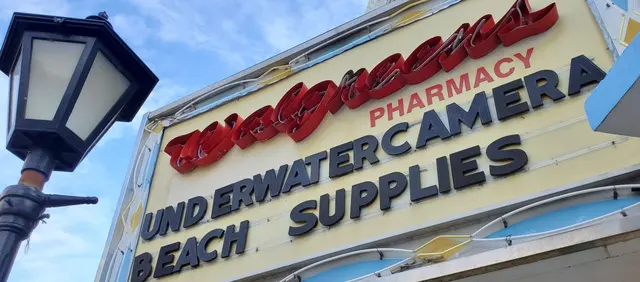 Walgreens Pharmacy underwater camera and beach supplies sign; scenery