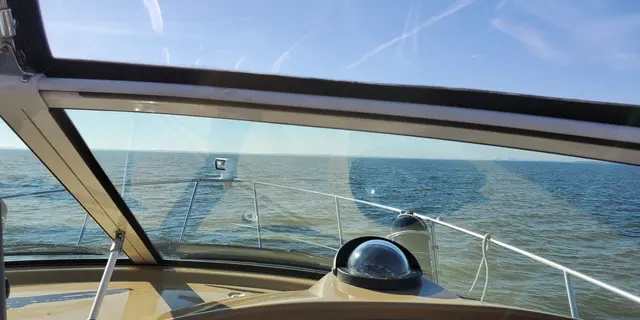 View from boat bow of open water and sky; scenery