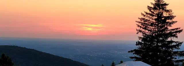 John and Lori watching the sun dip below the ridgeline