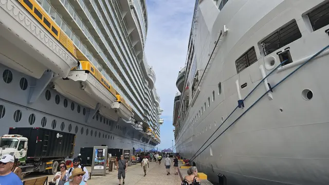 Walking the pier between two massive cruise ships.