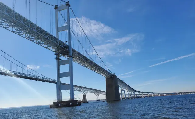 Chesapeake Bay Bridge towers against blue sky; scenery