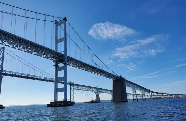 Chesapeake Bay Bridge towers against blue sky; scenery