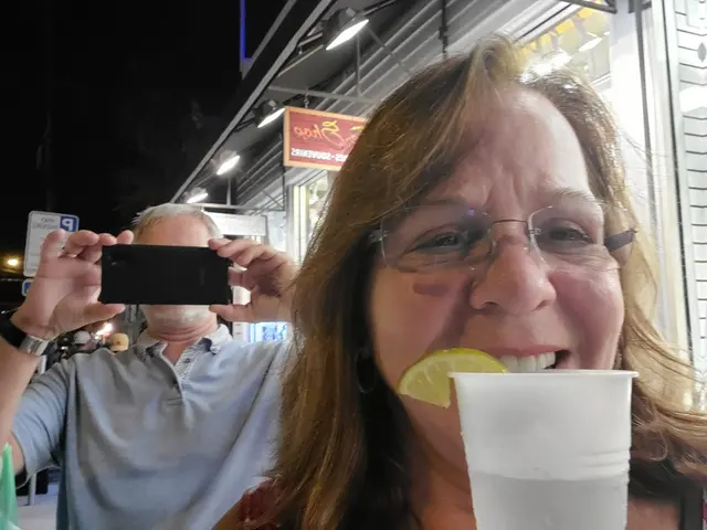 Goofy nighttime selfie with a lemon-wedge grin on Duval Street.