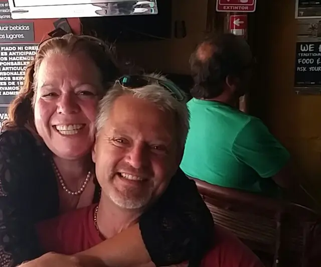 couple smiling together indoors at restaurant