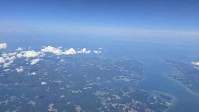 Flying south over the Chesapeake Bay, the coastline unfolding below.