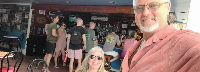 John and Lori grabbing a selfie at the bar