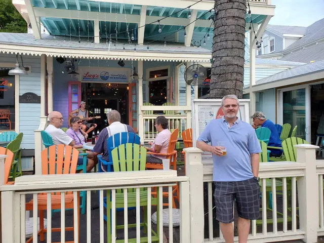 Happy hour on the porch at Lucy's Bar & Restaurant on Duval Street, live music playing.