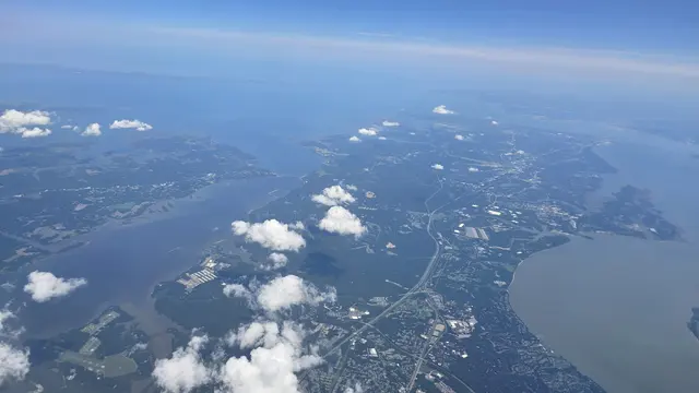 Rivers, inlets, and clouds from the window seat on the way down.