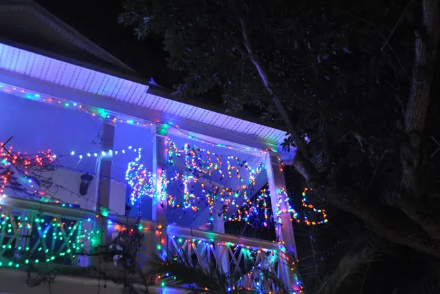 house decorated with Merry Christmas lights