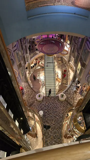 The ship's grand atrium, all lit up in the evening.