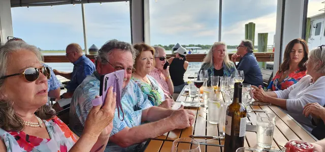 The whole crew gathered for a waterfront dinner