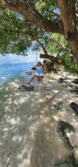 Lori wading in the surf during the beach stop near Tulum.