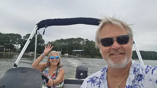 Out on the water, Lori at the helm