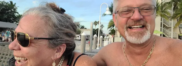 John and Lori sharing a smile at sunset
