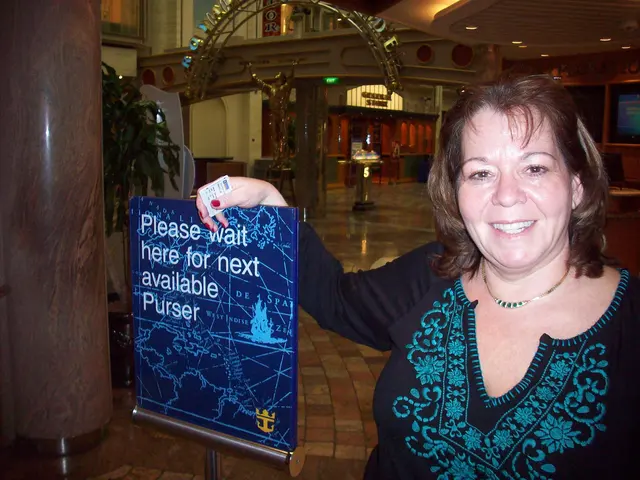 woman smiling on cruise ship near purser sign