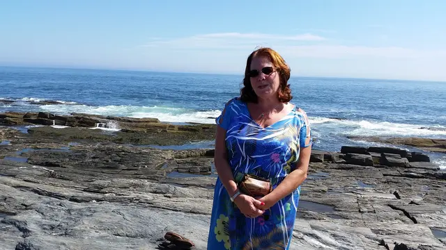 Waves crashing along the rocky Maine coastline