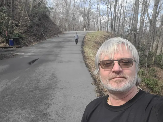 John catching up on the same mountain road walk