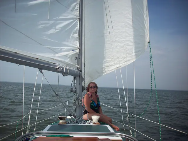 Lori on the bow of Namaste 1 (Columbia)