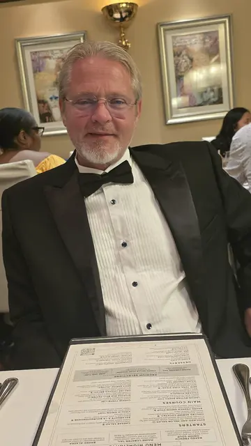 A warm dinner selfie together at sea.