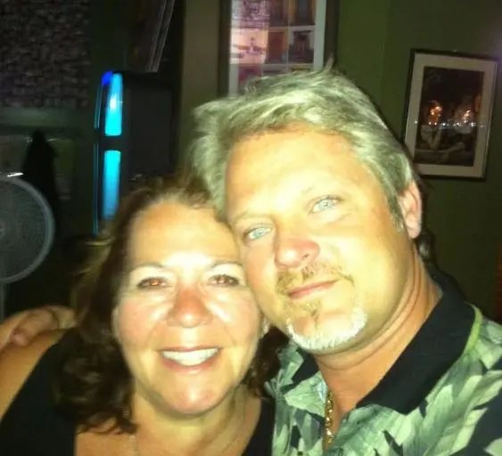 couple posing together indoors at night
