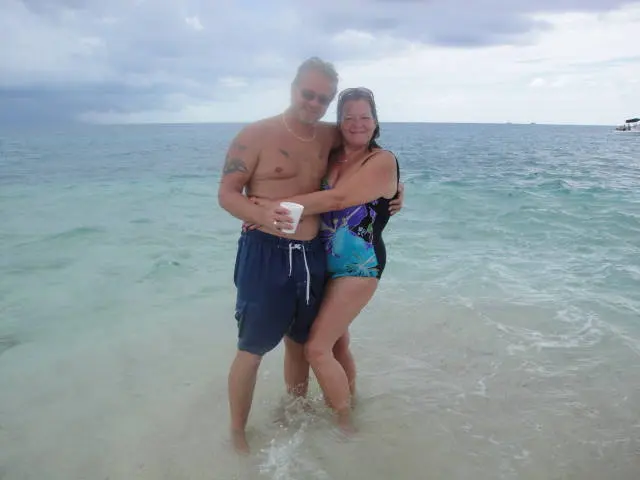 couple embracing in shallow water