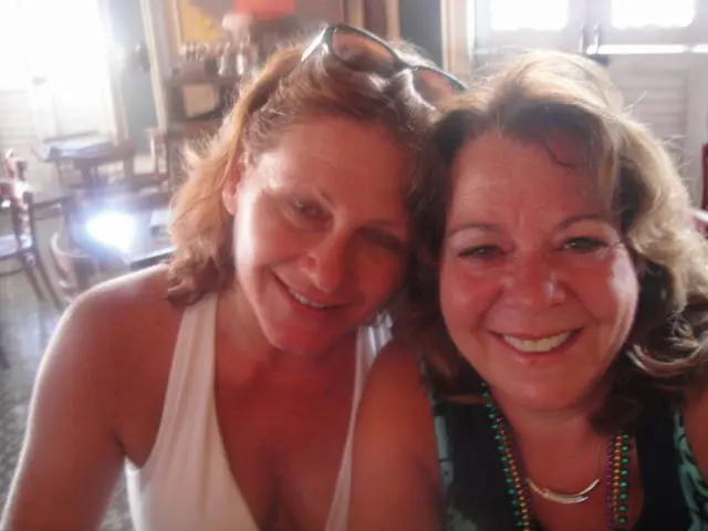 two women selfie indoors