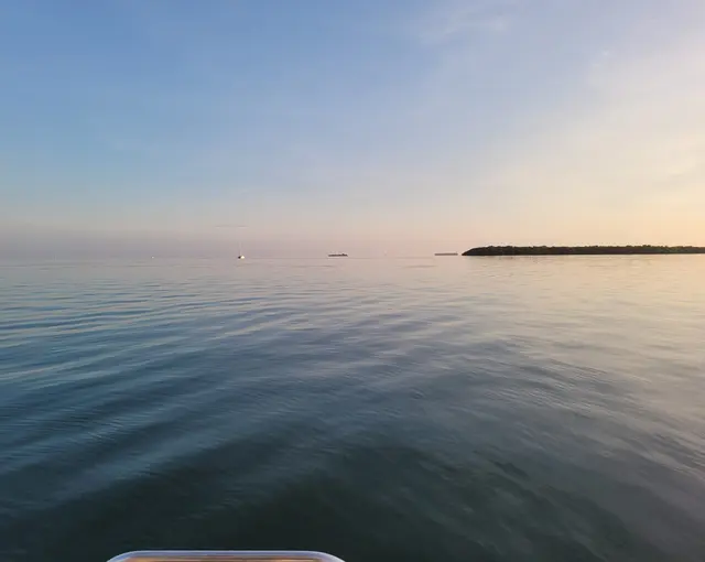Sunset silhouette over the water