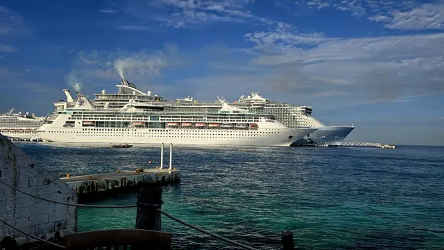 Another shot at the COZUMEL sign with the ships in the harbor.