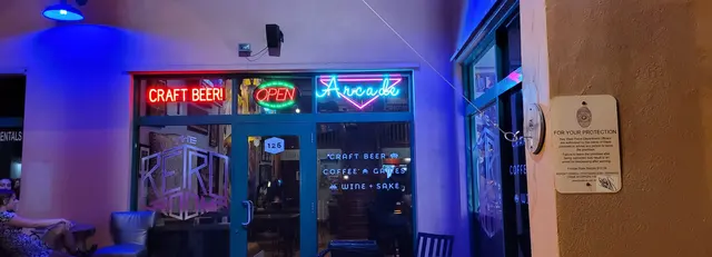 The Retro Room's neon arcade sign lighting up the night