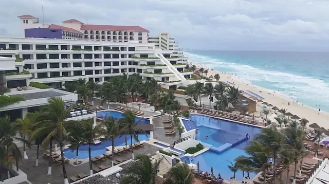 scenic aerial view of beach resort and pools