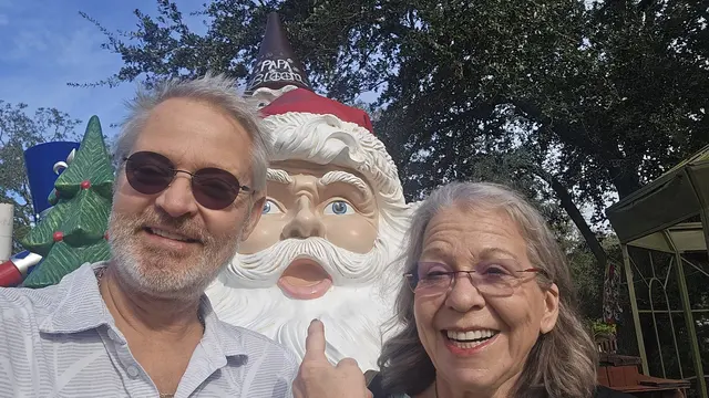 A goofy photo op with a giant Santa statue - 'Papa Bloom'.