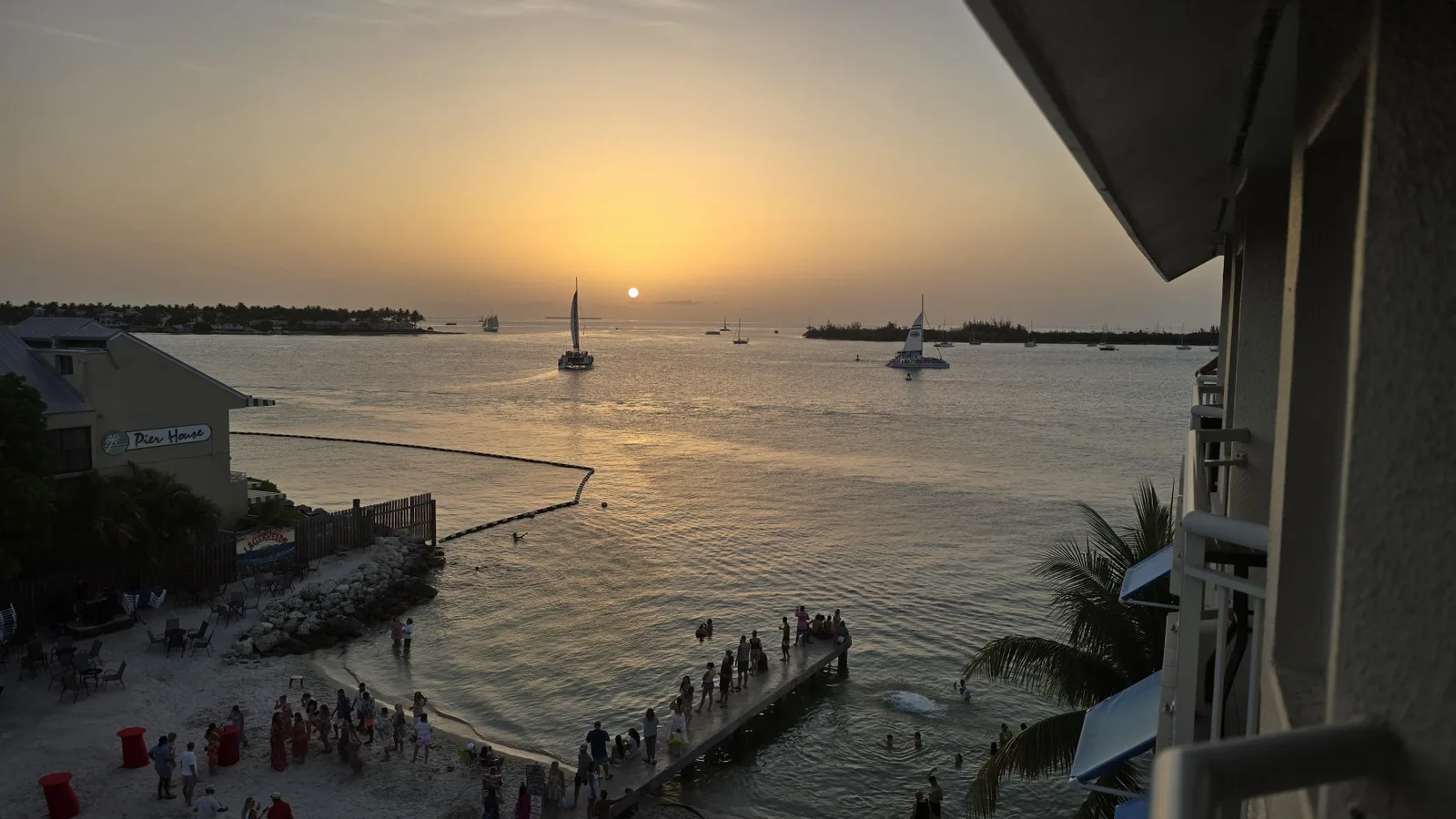Sailboats on the golden water at sunset in Key West