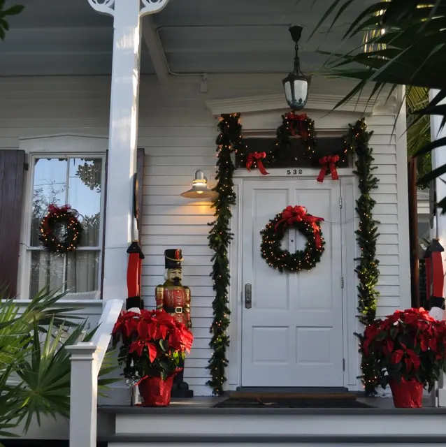 decorated house entrance with Christmas wreaths