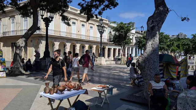 A street vendor's table of handmade crafts in the plaza