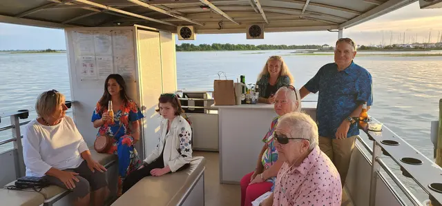 Friends relaxing aboard the pontoon boat