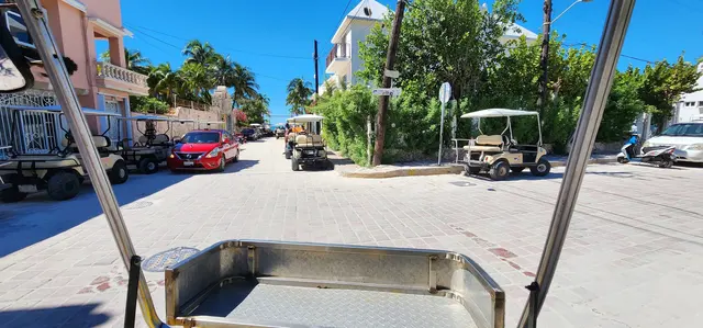 Cruising the colorful streets by golf cart on a town excursion.