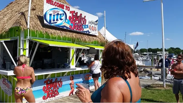 women in swimsuits at outdoor bar
