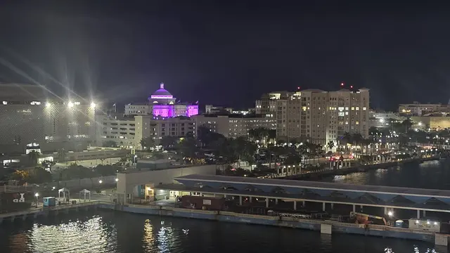 Lori enjoying the view from the ship's bow as San Juan fades into evening.