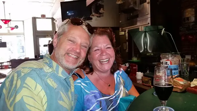 John and Lori sharing a laugh over drinks in Portland