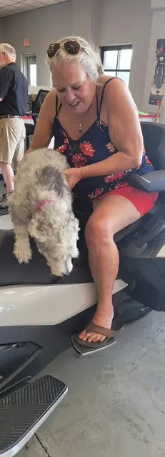 Another sweet moment with the fluffy shop dog.