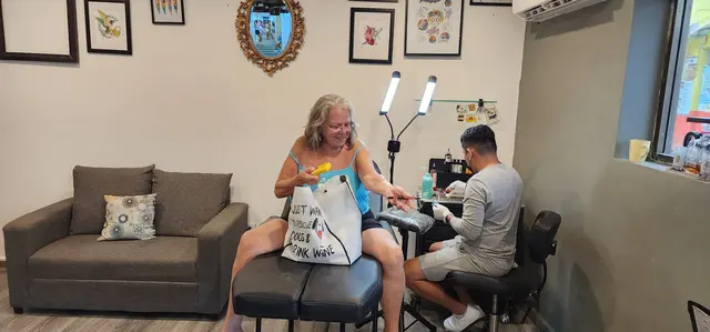 A little vacation ink — Lori getting a souvenir tattoo.