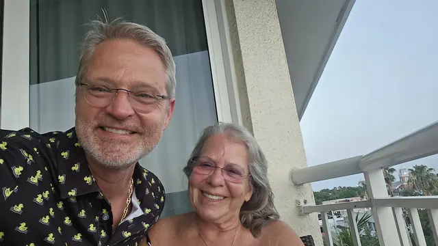 John's rubber-duck shirt makes an appearance for a balcony selfie with Lori.