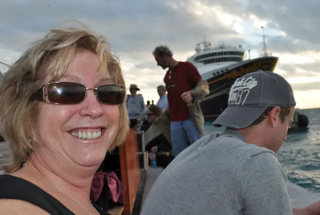 woman closeup with cruise ship in background